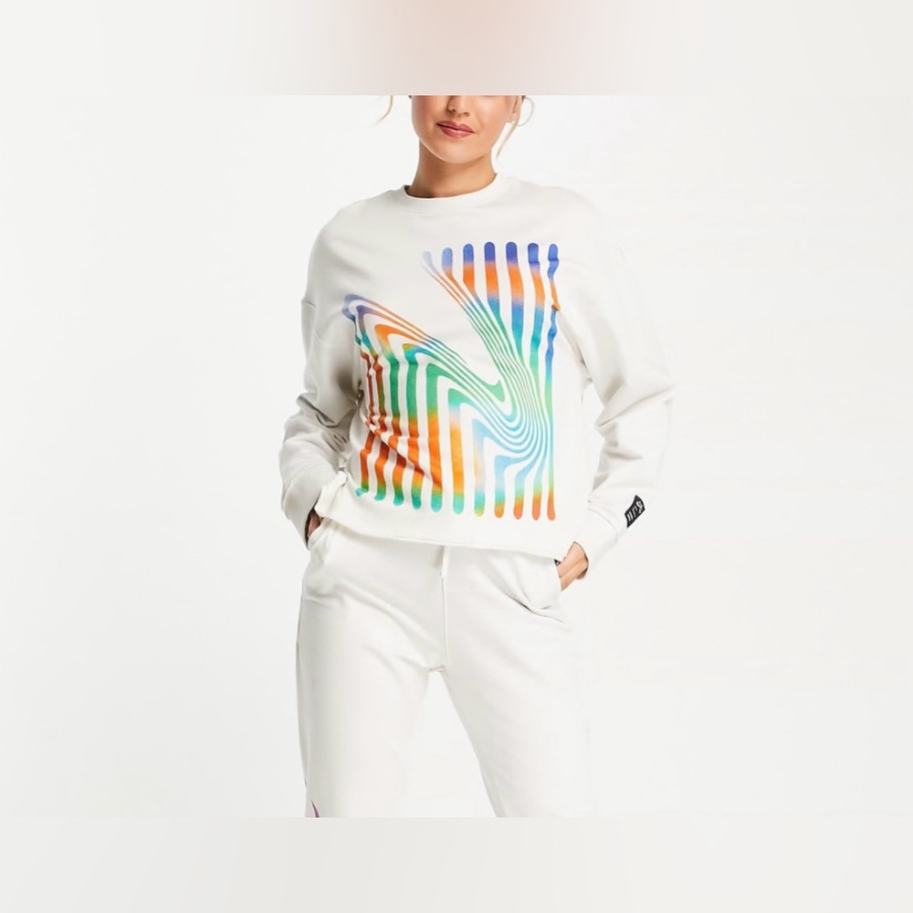 Nike yoga therma-fit luxe A.I.R. crewneck graphic sweatshirt in cream.